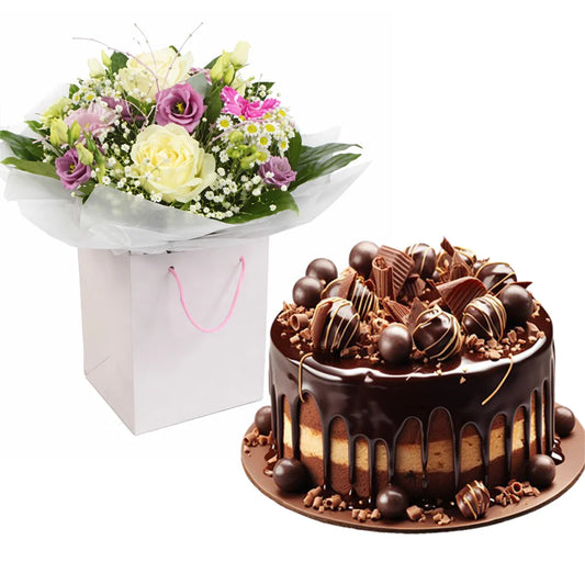 Аранжировка от свежи сезонни цветя и голяма торта